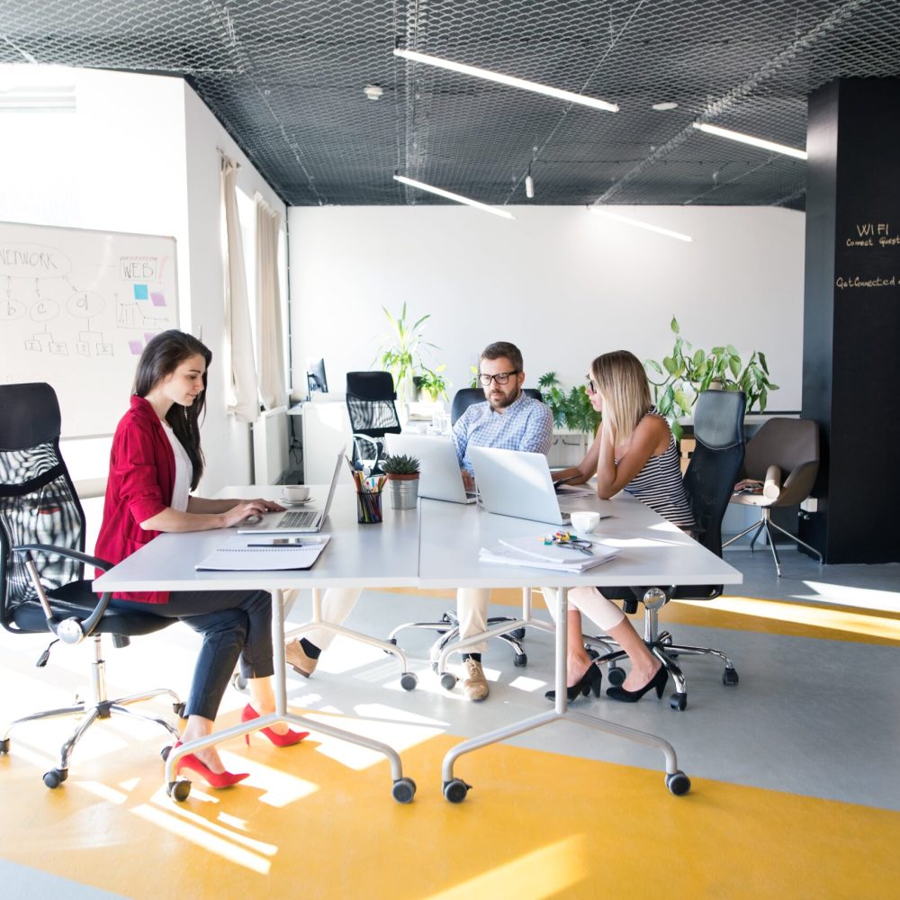 three-business-people-in-the-office-talking-togeth-2024-10-18-12-45-08-utc-min