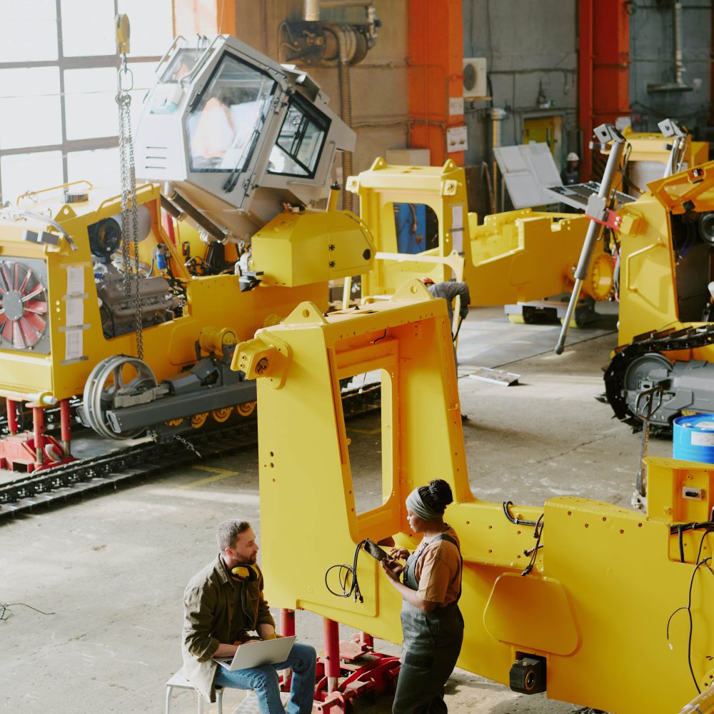 two-people-coworking-at-dozer-factory-2025-02-10-13-16-00-utc-min